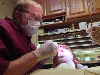 Dad working on a patient