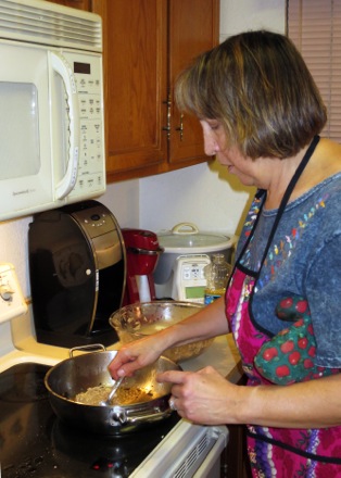 Karen making latkes