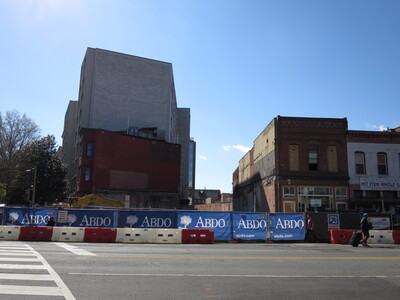 Until recently, the red building next to the Newport West was the home of Abdo Development, the company building these new apartments.