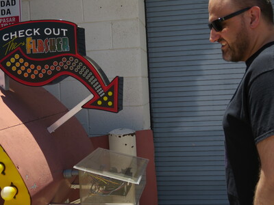 Bill wants to check out the flasher. This controls the chasing lights around the Arby's sign.