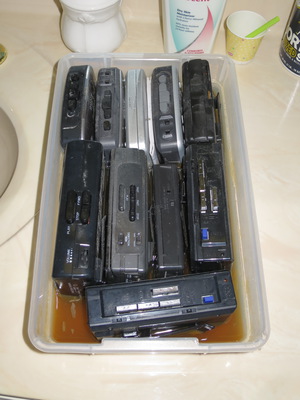 Audio Cassette players swimming in water due to an earlier unrelated leak