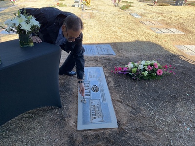 Alan Leffler placing a stone on the stone