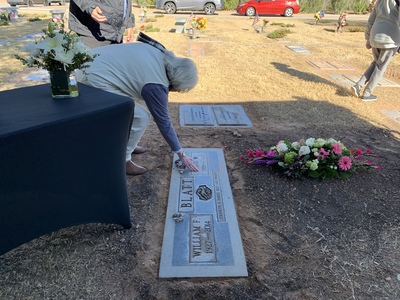 Other mourners placed stones as well