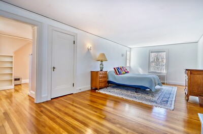 Primary bedroom with door to the secret sun room