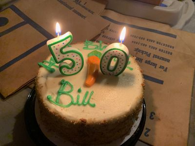 Karen and I snuck downstairs to prepare the cake for Bill