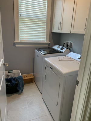 After the half bath is the laundry room.