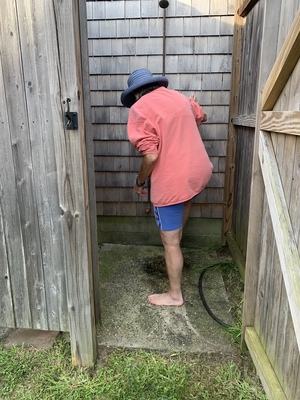 Cleaning off our sandy feet in Karen's outdoor shower