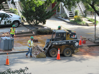 This John Deere Skid Steer Loader helps move the heavy stuff.