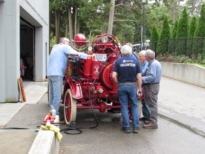 A team is working on getting this antique fire truck working again.